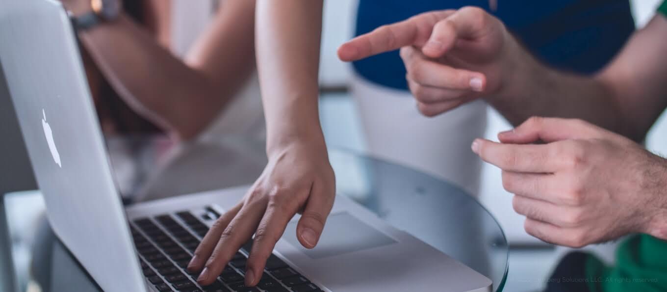 Hand Pointing at a Laptop - 7 Tips to Secure Effective Cross-Team Collaboration with IT Vendors - Lemberg Solutions.jpg Hand Pointing at a Laptop - 7 Tips to Secure Effective Cross-Team Collaboration with IT Vendors - Lemberg Solutions.jpg
